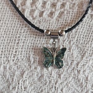 Beautiful Butterfly pendant and black rope necklace.